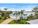 Waterfront home with double garage and palm trees at 2806 Bay Vista Ct, New Smyrna Beach, FL 32168