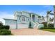 Two-story waterfront home with double garage and a grand staircase at 2806 Bay Vista Ct, New Smyrna Beach, FL 32168