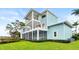Three-story waterfront home with screened porch and backyard at 2806 Bay Vista Ct, New Smyrna Beach, FL 32168