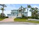 Luxury waterfront home with double garage and manicured lawn at 2806 Bay Vista Ct, New Smyrna Beach, FL 32168