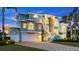 Two-story waterfront home with inviting front entrance and landscaping at 2806 Bay Vista Ct, New Smyrna Beach, FL 32168