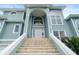 Front entrance with grand staircase leading to a two story home at 2806 Bay Vista Ct, New Smyrna Beach, FL 32168