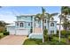 Two-story home with a large staircase and two-car garage at 2806 Bay Vista Ct, New Smyrna Beach, FL 32168