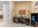 Bright home office features built-in desk and cabinets at 2806 Bay Vista Ct, New Smyrna Beach, FL 32168