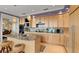 Gourmet kitchen with island, granite countertops, and stainless steel appliances at 2806 Bay Vista Ct, New Smyrna Beach, FL 32168