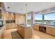 Modern kitchen with island, granite countertops, and water views at 2806 Bay Vista Ct, New Smyrna Beach, FL 32168