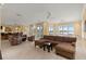 Spacious living room with water views and L-shaped sectional at 2806 Bay Vista Ct, New Smyrna Beach, FL 32168