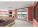 Spacious main bedroom with water views and access to a private balcony at 2806 Bay Vista Ct, New Smyrna Beach, FL 32168