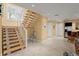 Modern staircase with wood steps and metal railing at 2806 Bay Vista Ct, New Smyrna Beach, FL 32168