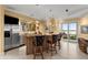 Stylish wet bar with stainless steel appliances and seating at 2806 Bay Vista Ct, New Smyrna Beach, FL 32168