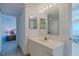 Bathroom with vanity and mirror at 2967 S Atlantic Ave # 1706, Daytona Beach, FL 32118