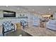 Community room with seating, a large TV, and a kitchenette at 2967 S Atlantic Ave # 1706, Daytona Beach, FL 32118