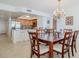 Bright dining room with a wood table and kitchen access at 2967 S Atlantic Ave # 1706, Daytona Beach, FL 32118
