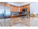 Granite countertop kitchen with stainless steel appliances at 2967 S Atlantic Ave # 1706, Daytona Beach, FL 32118