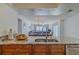 Kitchen with granite island and view into dining area at 2967 S Atlantic Ave # 1706, Daytona Beach, FL 32118