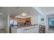 Kitchen with granite countertop and breakfast bar at 2967 S Atlantic Ave # 1706, Daytona Beach, FL 32118