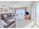 Spacious living room with ocean view and comfortable leather furniture at 2967 S Atlantic Ave # 1706, Daytona Beach, FL 32118