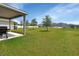 Large backyard with grassy area and patio at 3009 Lake Tahoe St, Deland, FL 32724