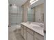 Shared bathroom with double sinks and bathtub at 3009 Lake Tahoe St, Deland, FL 32724