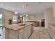 Open concept kitchen with island and stainless steel appliances at 3009 Lake Tahoe St, Deland, FL 32724
