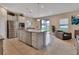 Island kitchen with granite countertops, stainless steel appliances, and view to backyard at 3009 Lake Tahoe St, Deland, FL 32724