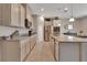 Modern kitchen with granite countertops and stainless steel appliances at 3009 Lake Tahoe St, Deland, FL 32724
