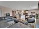Open living room with sectional sofa and view to kitchen at 3009 Lake Tahoe St, Deland, FL 32724