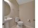 Convenient powder room with pedestal sink and toilet at 3009 Lake Tahoe St, Deland, FL 32724