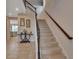 Elegant staircase with dark wood railings and beige carpeting at 3009 Lake Tahoe St, Deland, FL 32724