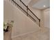 Elegant staircase with wrought iron railing at 3009 Lake Tahoe St, Deland, FL 32724