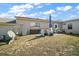Spacious backyard with brick patio, open lawn, and utilities at 30215 Tavares Ridge Blvd # 11, Tavares, FL 32778