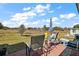 Outdoor patio with peaceful backyard view of lawn and trees at 30215 Tavares Ridge Blvd # 11, Tavares, FL 32778