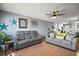 Comfortable living room featuring tile floors, neutral paint, and plush seating at 30215 Tavares Ridge Blvd # 11, Tavares, FL 32778