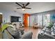 Comfortable living room showcasing modern decor, tile floors, and a cozy seating area at 30215 Tavares Ridge Blvd # 11, Tavares, FL 32778