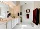 Clean bathroom with double vanity, and a large mirror at 3162 Kailani Ct, Ormond Beach, FL 32174