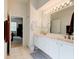 Double vanity bathroom with view into bedroom at 3162 Kailani Ct, Ormond Beach, FL 32174