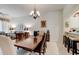 Dining room with a large wooden table and chandelier at 3162 Kailani Ct, Ormond Beach, FL 32174