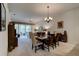 Spacious dining room with a wooden table, connecting to the living room at 3162 Kailani Ct, Ormond Beach, FL 32174