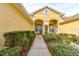 Welcoming front entry with a walkway, landscaping, and seating area at 3162 Kailani Ct, Ormond Beach, FL 32174