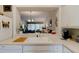 Kitchen features a breakfast bar overlooking the living room at 3162 Kailani Ct, Ormond Beach, FL 32174