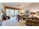 Relaxing living room with sliding doors leading to a patio at 3162 Kailani Ct, Ormond Beach, FL 32174