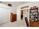 Home office with desk, bookshelf, and built-in wardrobe at 3162 Kailani Ct, Ormond Beach, FL 32174