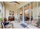 Relaxing screened porch with tiled floor and wicker furniture at 3162 Kailani Ct, Ormond Beach, FL 32174