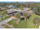 Aerial view of a house with solar panels and palm trees at 3604 Socha Way, Port Orange, FL 32129