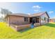 Brick house exterior with a sunroom and well-maintained lawn at 3604 Socha Way, Port Orange, FL 32129