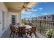 Private balcony with table and chairs, offering a city view at 424 Luna Bella Ln # 332, New Smyrna Beach, FL 32168