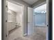 Clean bathroom with white cabinets, tile flooring, and a toilet at 424 Luna Bella Ln # 332, New Smyrna Beach, FL 32168