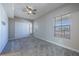 Well-lit bedroom with carpet floors and double door closet at 424 Luna Bella Ln # 332, New Smyrna Beach, FL 32168