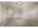 Primary bedroom with ceiling fan and ensuite bathroom access at 424 Luna Bella Ln # 332, New Smyrna Beach, FL 32168