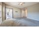 Bedroom with sliding doors to balcony and ceiling fan at 424 Luna Bella Ln # 332, New Smyrna Beach, FL 32168